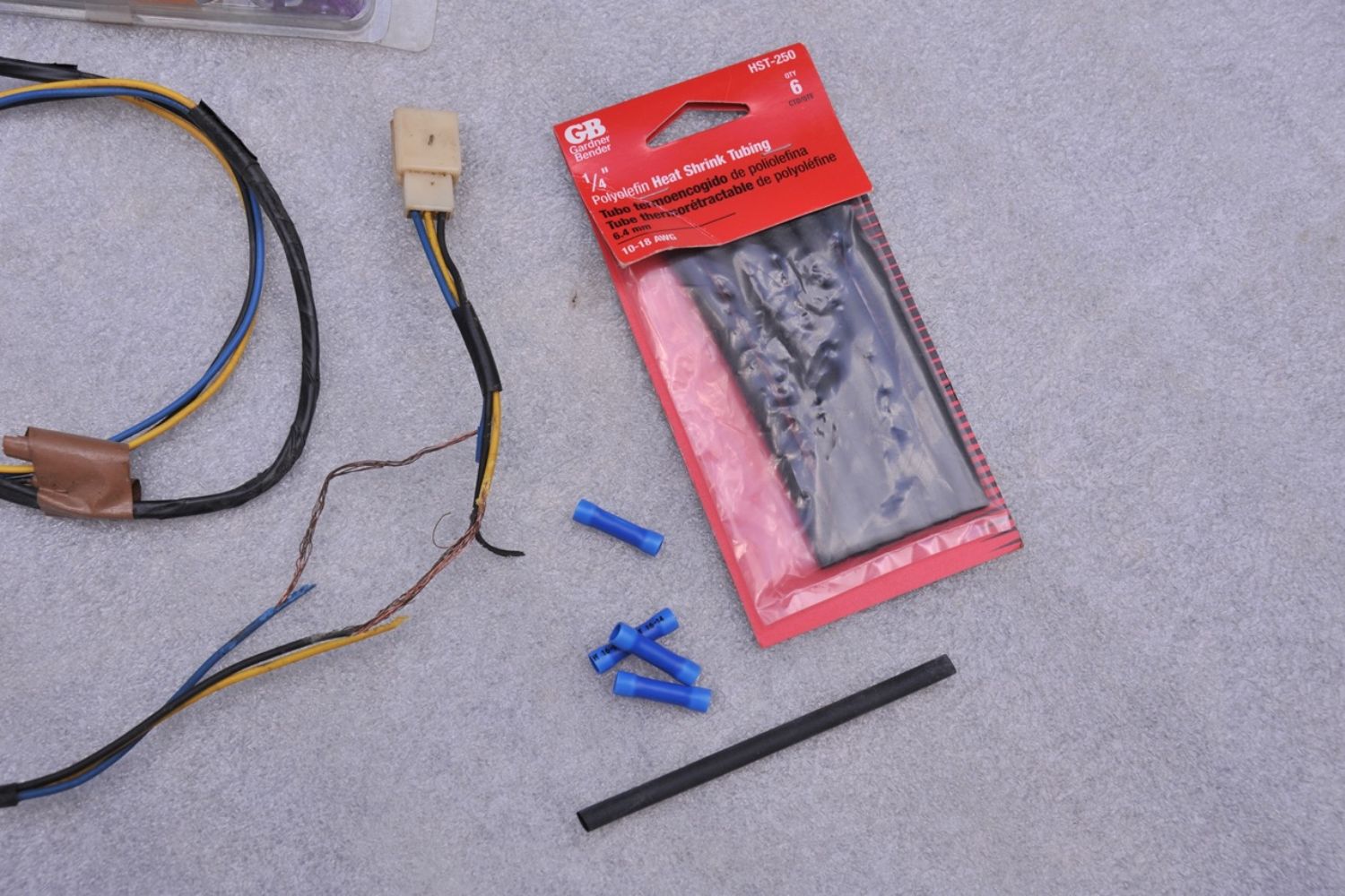 This is a mice chewed wiring harness, it was repaired with butt connecters and then sealed with heat shrink tubing