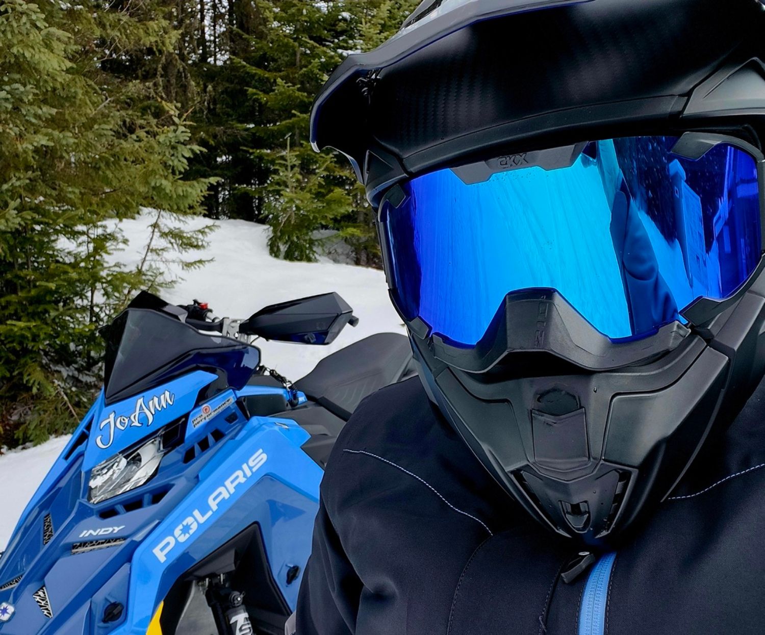 Our colleague JoAnn Winter (discreetly hidden behind her visor) is an ambassador for women in the world of snowmobiling.