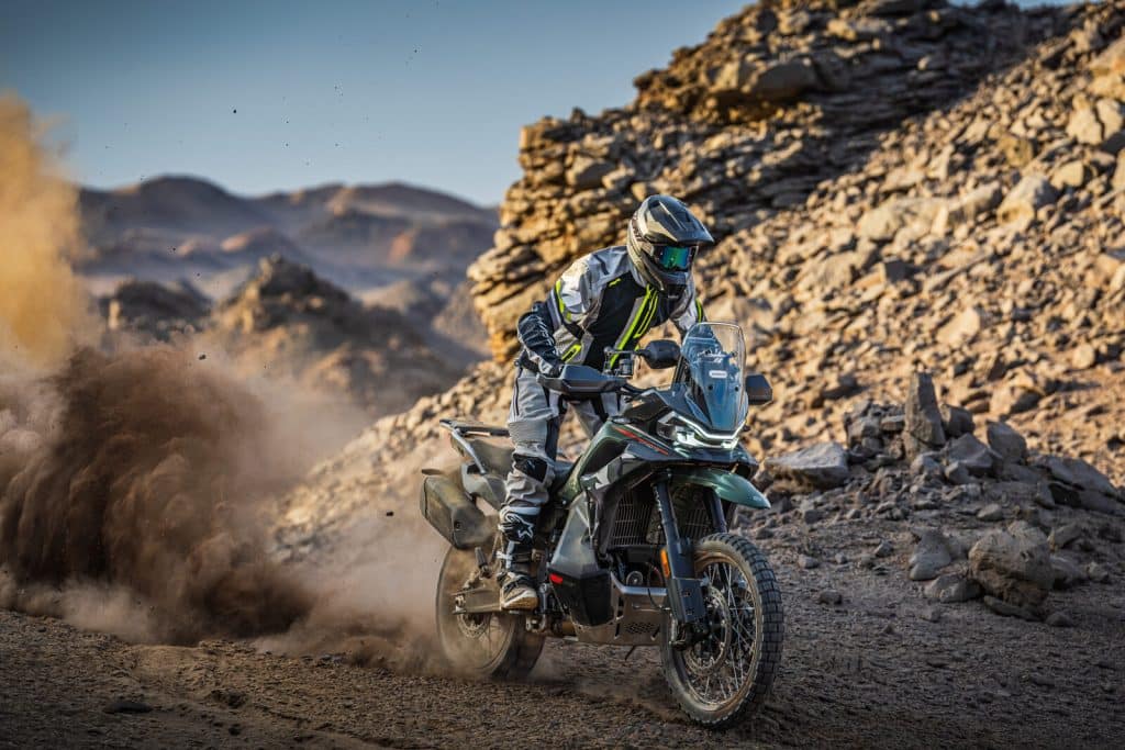 2027 CFMOTO IBEX 950 adventure motorcycle riding off-road